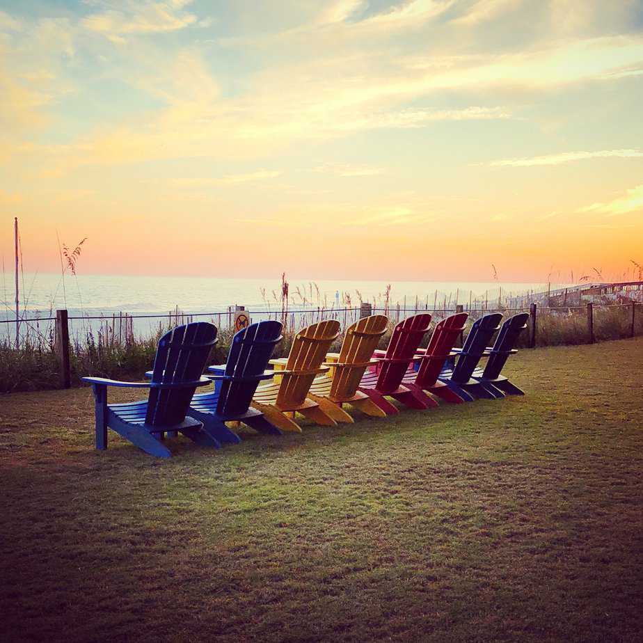 Summer vacation ideas Gulf beach view colorful chairs at Orange Beach