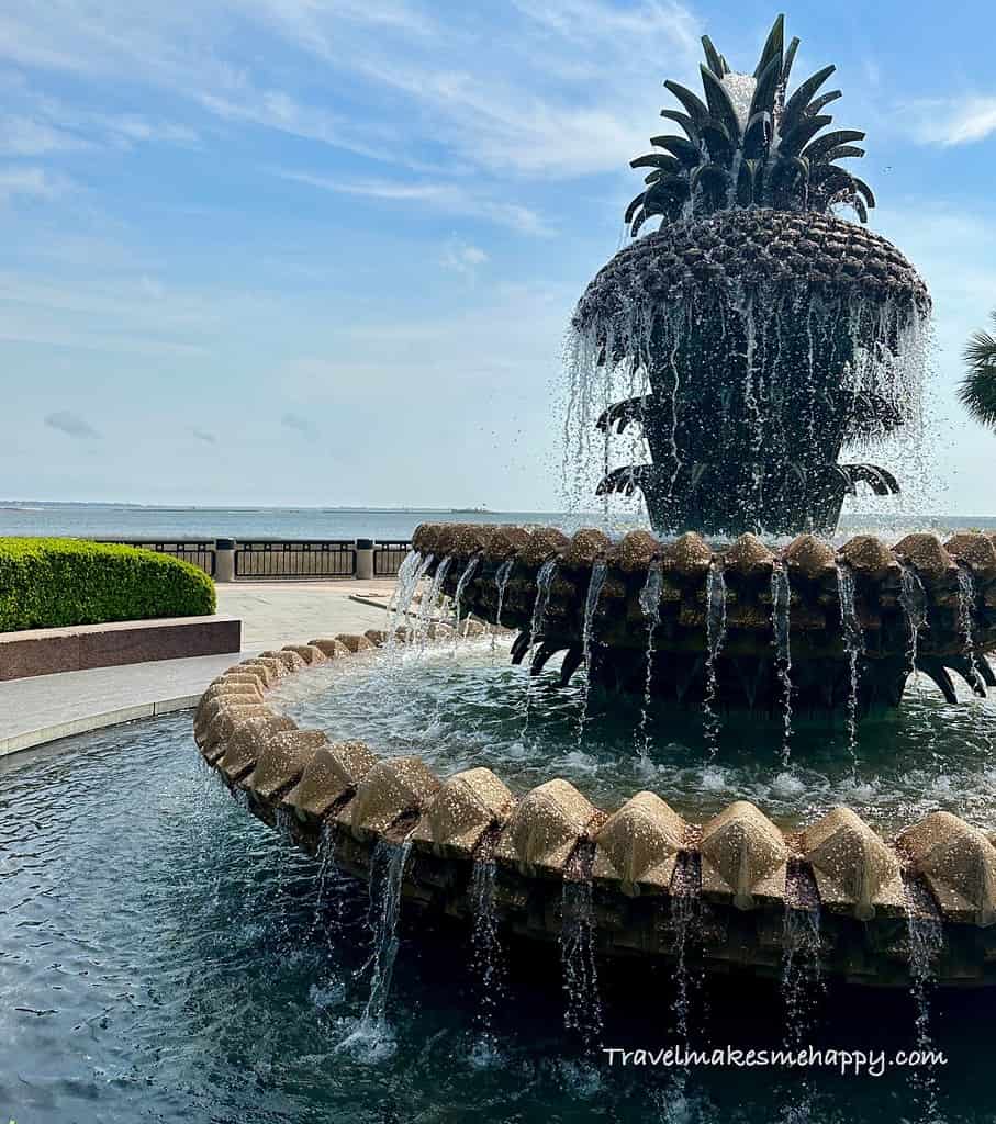 The charleston pineapple fountain with a harbor view