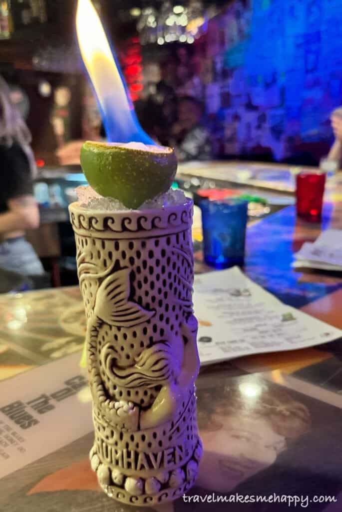 mermaid tiki drink with fire on top at Red Dwarf tiki cocktail bar in Las Vegas