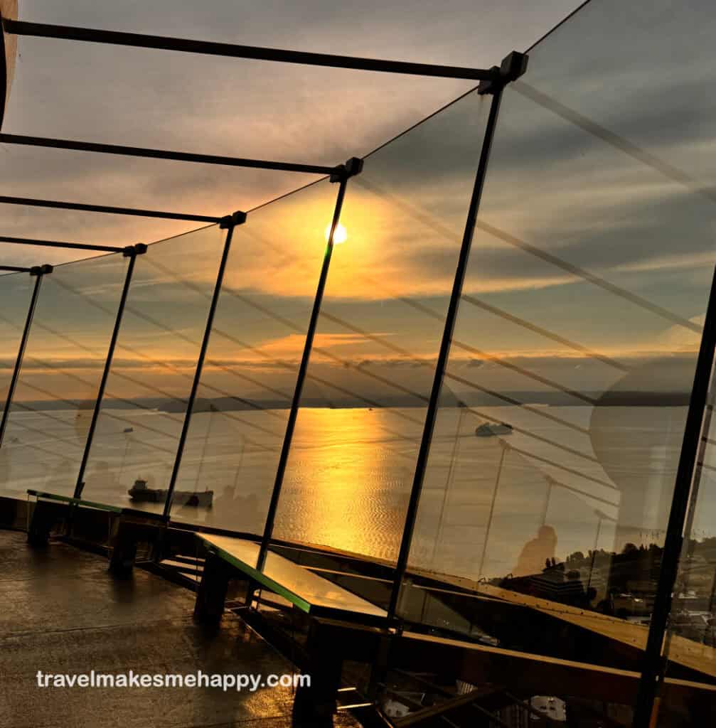 sunset view from top of seattle space needle overlooking the city