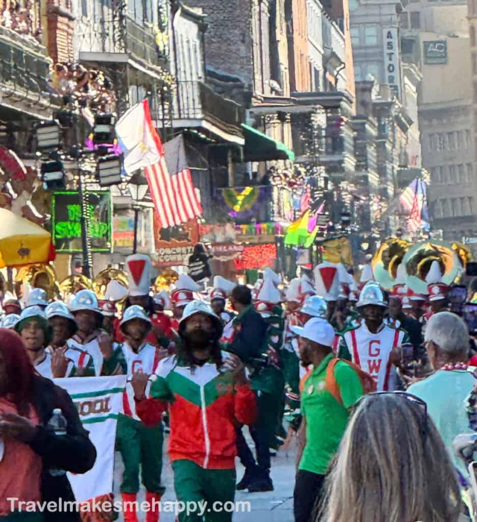 Krewe of Cork parade on Bourbon Street in New Orleans marching band