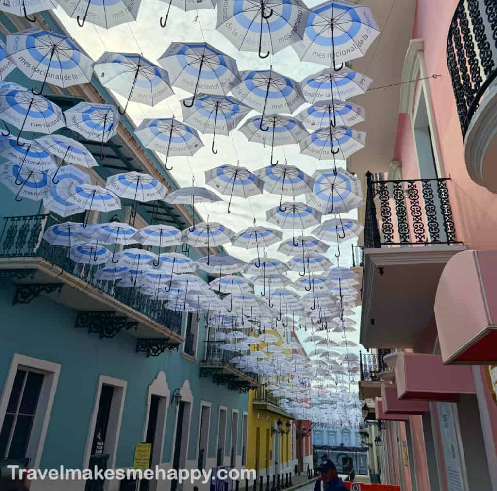 calle fortalezza umbrella street old san juan puerto rico travel guide