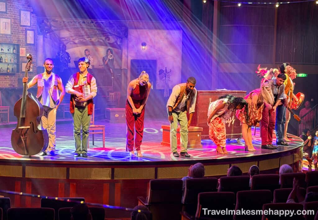 dancers taking bow in theater on celebrity reflection cruise ship show