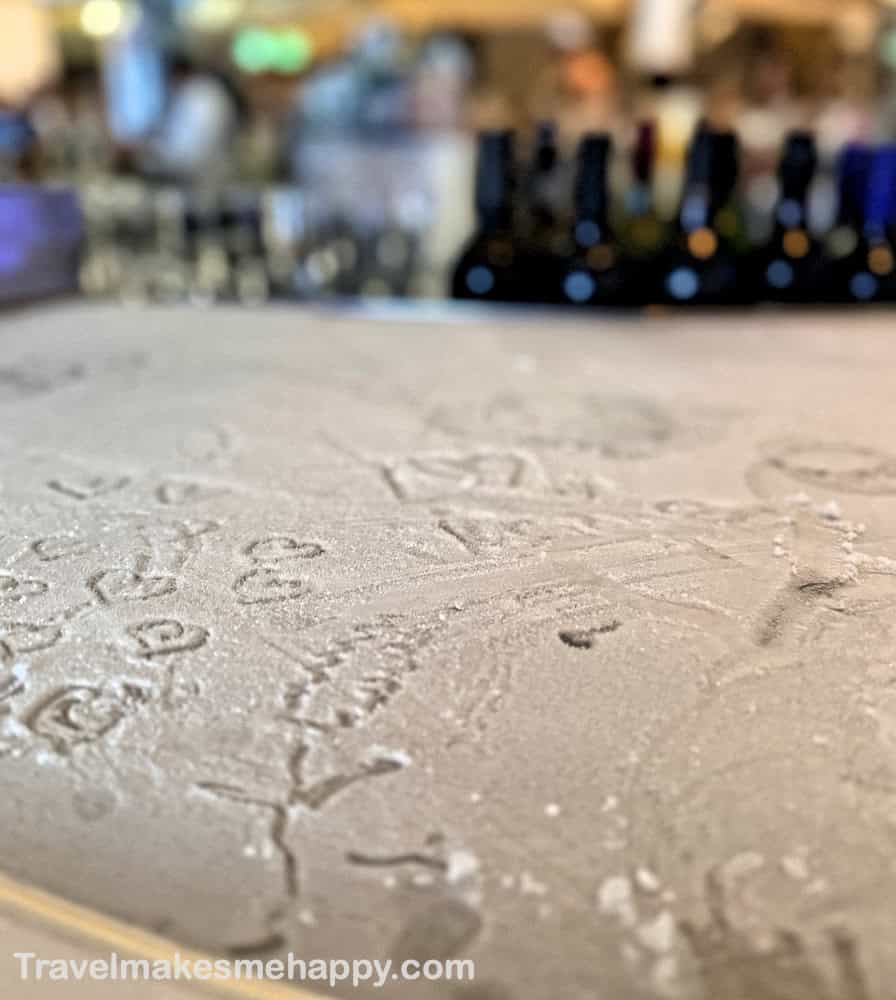 ice martini bar surface with bar in background on celebrity reflection ship