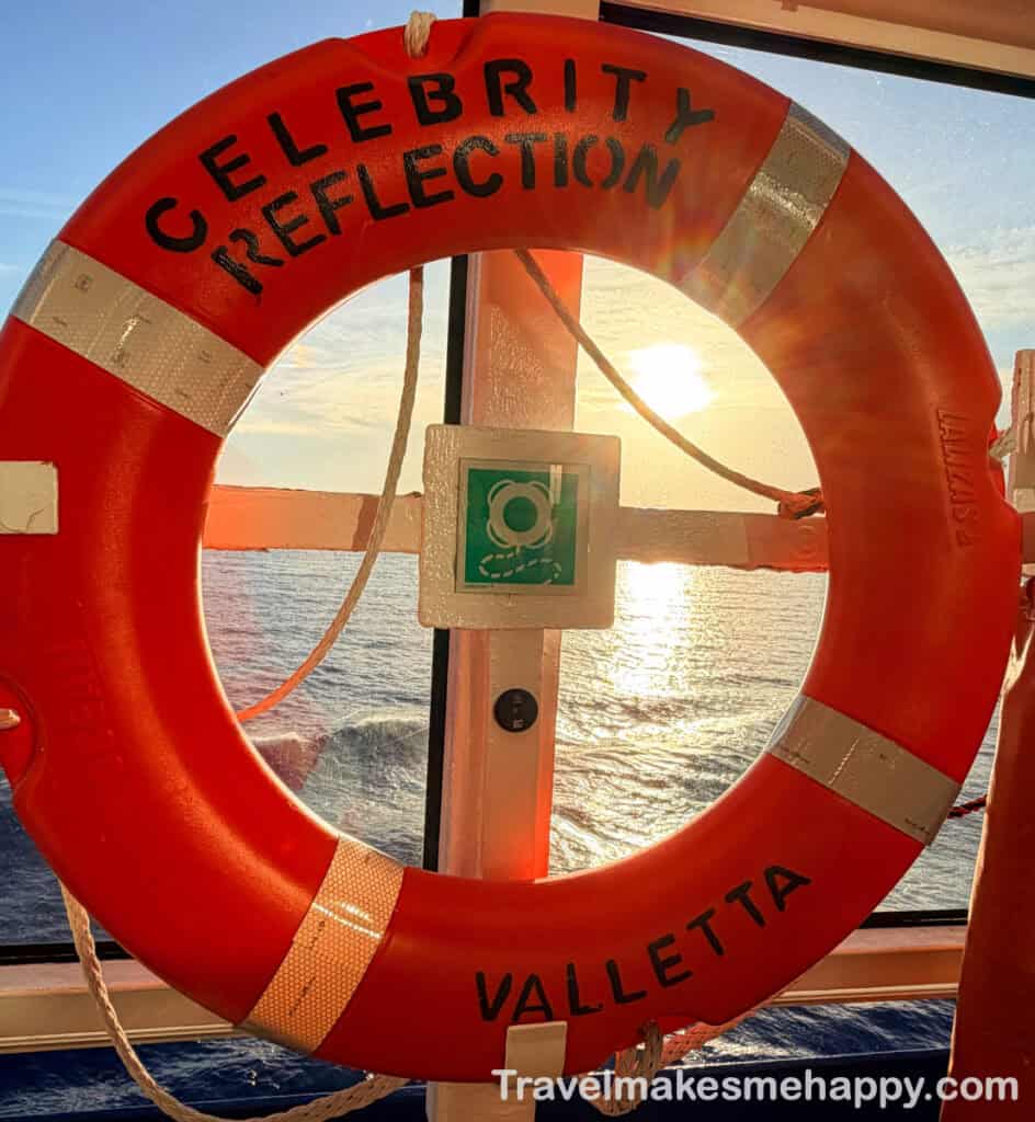sunset through live preserver on celebrity reflection cruise ship vacation